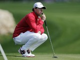 Rory McIlroy waits for his turn to putt on the first green during the third round of the Texas Open golf tournament on April 6, 2013