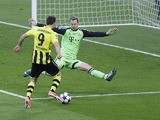 Bayern goalkeeper Manuel Neuer blocks a shot by Dortmund's Robert Lewandowski during the Champions League final on May 25, 2013