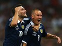Kenny Miller of Scotland celebrates with team-mate Robert Snodgrass of Scotland after scoring a goal during the International Friendly match between England and Scotland at Wembley Stadium on August 14, 2013 