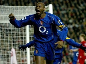 Patrick Vieira celebrates scoring for Arsenal against Liverpool at Anfield.