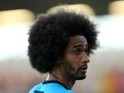 Spurs' Benoit Assou-Ekotto warms up before a friendly with Colchester on July 19, 2013