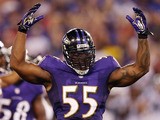 Outside linebacker Terrell Suggs #55 of the Baltimore Ravens gestures to the crowd during the second half of a preseason game against the Carolina Panthers at M&T Bank Stadium on August 22, 2013