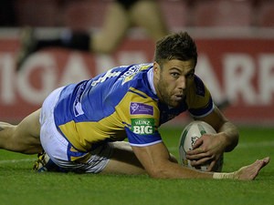 Leeds Rhino's Joel Moon scores his team's first try against Wigan Warriors on September 27, 2013
