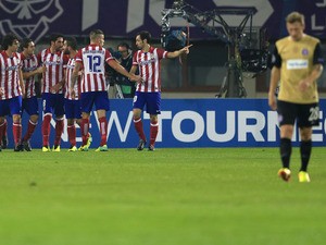 Atletico Madrid's team celebrates a goal by midfielder Raul Garcia against Austria Wien during the UEFA Champions League Group G football match Austria Wien vs Atletico de Madrid in Vienna, Austria on October 22, 2013