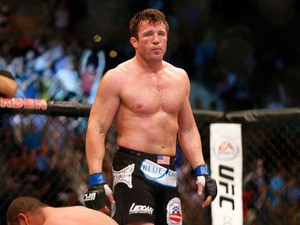 Chael Sonnen reacts after winning the fight with a tap out by guillotine choke against Mauricio Rua in their light heavyweight bout at TD Garden on August 17, 2013
