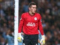 Lee Nicholls of Wigan Athletic retrieves the ball after Jesus Navas of Manchester City had scored the fifth goal during the Capital One Cup third round match between Manchester City and Wigan Athletic at Etihad Stadium on September 24, 2013