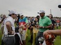 Rory McIlroy and Tiger Woods during their exhibition match at Mission Hills Golf Club in China on October 28, 2013