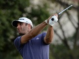 Dustin Johnson of the US tees off at the 12th hole before finishing in the lead on day two of the WGC-HSBC Champions tournament at the Shanghai Sheshan International Golf Club on November 1, 2013