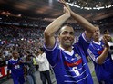 French Youri Djorkaeff waves to the crowd after the football exhibition match between France's 1998 World Cup champions and a world selection team, on July 12, 2008
