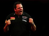 Adrian Lewis of England celebrates winning a set during the quarter final match between Adrian Lewis of England and Michael Van Gerwen of Netherlands on December 29, 2012