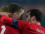 Austria's Christian Fuchs congratulates teammate Marc Janko after scoring the opening goal against USA during their international friendly match on November 19, 2013