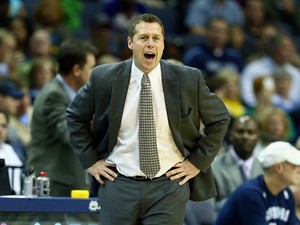 Dave Joerger the head coach of the Memphis Grizzlies gives instructions to his team during the NBA game against the Boston Celtics at FedExForum on November 4, 2013