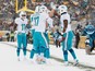 Charles Clay #42 of the Miami Dolphins celebrates his second quarter touchdown against the Pittsburgh Steelers with teammates including Ryan Tannehill #17 at Heinz Field on December 8, 2013