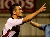Jack Marriott of Woking celebrates after opening the scoring during the Skrill Conference Premier League match between Woking and Dartford at the Kingfield Stadium on November 12, 2013