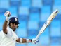 Sri Lankan batsman Mahela Jayawardene raises his bat in celebration after scoring a century (100 runs) during the second day of the second cricket Test match between Pakistan and Sri Lanka at the Dubai International Cricket Stadium in Dubai on January 9, 
