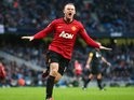 Wayne Rooney celebrates scoring against Manchester City on December 09, 2012.