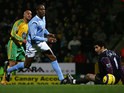 Norwich's Leon McKenzie scores against Manchester City during their Premier League match on February 28, 2005