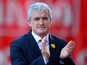 Stoke City Manager Mark Hughes walks to the dugout prior to the Barclays Pemier League match between Stoke City and Arsenal at the Britannia Stadium on March 1, 2014