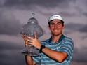 Russell Henley celebrates with the trophy after winning The Honda Classic at PGA National Resort and Spa on March 2, 2014