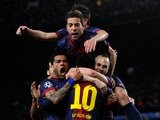 Barcelona players celebrate Lionel Messi's goal against AC Milan on March 12, 2013.