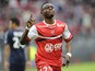 Valenciennes's Majeed Waris celebrates after scoring a goal during the French L1 football match Valenciennes vs Lyon on April 6, 2014
