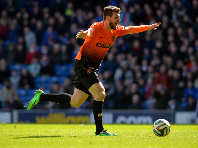 Nadir Ciftci of Dundee United celebrates scoring during the William Hill Scottish Cup Semi Final between Rangers and Dundee United at Ibrox Stadium on April 12, 2014