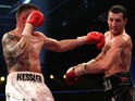 Mikkel Kessler of Denmark (L) lands a left cross on Carl Froch of England during their Super Six WBC Super Middleweight title fight on April 24, 2010