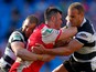 Jordan Cox of Hull KR is tackled by Mark O'Meley and Daniel Holdsworth of Hull FC during the Super League Magic Weekend match between Hull FC and Hull Kingston Rovers at the Etihad Stadium on May 25, 2013