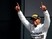 Lewis Hamilton of Great Britain and Mercedes GP celebrates on the podium after winning the British Formula One Grand Prix at Silverstone Circuit on July 6, 2014