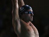 Chris Walker-Hebborn of England stretching before the men's 50m backstroke heat on July 26, 2014