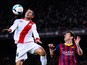 Lionel Messi of FC Barcelona duels for the ball with Iago Falque of Rayo Vallecano during the La Liga match between FC Barcelona and Rayo Vallecano de Madrid at Camp Nou on February 15, 2014