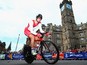 Steve Cummings of England goes past The Tolbooth during the Men's individual time trial during day eight of the Glasgow 2014 Commonwealth Games on July 31, 2014
