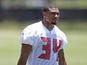 Running Back Charles Sims #34 of the Tampa Bay Buccaneers works out during the first day of rookie minicamp on May 16, 2014