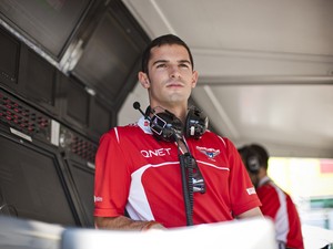 Reserve driver Alexander Rossi of the United States and Marussia looks on from the pit wall during practice ahead of the Hungarian Formula One Grand Prix at Hungaroring on July 25, 2014