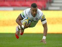 Anthony Watson of Bath Rugby dives over the line to score his teams first try during the Aviva Premiership match against Sale Sharks on September 5, 2014