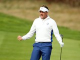 Ian Poulter of Europe celebrates chipping in on the 15th hole during the Morning Fourballs of the 2014 Ryder Cup on the PGA Centenary course at Gleneagles on September 27, 2014