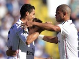 Real Madrid's Portuguese forward Cristiano Ronaldo celebrates his goal with Real Madrid's Portuguese defender Pepe during the Spanish league football match on October 18, 2014