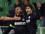 Inter Milan's defender from Brazil Dodo is congratuled by teammate Inter Milan's defender from Brazil Juan after scoring during the Europa League football match AS Saint-Etienne against FC Internazionale Milan on November 6, 2014