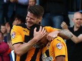 Kwesi Appiah of Cambridge celebrates with team mate and captain Michael Nelson after scoring his and the teams second goal of the game during the Sky Bet League Two match between Cambridge United and Oxford United at The Abbey Stadium on October 11, 2014