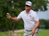 Charley Hoffman of the United States celebrates after putting out on the 9th green during the final round of the OHL Classic at the Mayakoba El Camaleon Golf Club on November 16, 2014