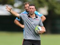 Assistant coach Aaron Mauger gives instuctions during a Crusaders Super Rugby training session at Rugby Park on February 19, 2014
