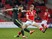 Adam Clayton of Middlesbrough clears the ball from Luke Berry of Barnsley during the FA Cup Third Round match on January 3, 2015