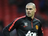 Manchester United's Spanish goalkeeper Victor Valdes warms up ahead of the English Premier League football match between Manchester United and Southampton at Old Trafford in Manchester, north west England, on January 11, 2015