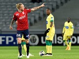 Lille's Danish defender Simon Kjaer (L) celebrates after scoring his team's second goal during the French League Cup football match Lille (LOSC) vs Nantes (FCN) on January 14, 2014