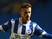 Joe Bennett of Brighton is challenged by Roger Espinoza of Wigan during the Sky Bet Championship match against Wigan Athletic on November 4, 2014