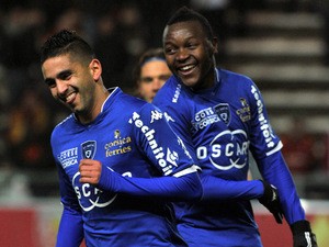 Bastia's French Algerian midfielder Ryad Boudebouz celebrates after scoring during the French L1 football match between Lens and Bastia at the Licorne stadium in Amiens on January 31, 2014
