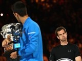 Andy Murray of Great Britain looks on as Novak Djokovic of Serbia holds the Norman Brookes Challenge Cup after he won the Australian Open on February 1, 2015
