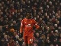 Liverpool's Italian striker Mario Balotelli gives a thumbs up after scoring Liverpool's third goal during the English Premier League football match between Liverpool and Tottenham Hotspur at the Anfield stadium in Liverpool, northwest England, on February