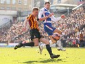 Stephen Darby of Bradford City takes a shot on goal under pressure from Oliver Norwood of Reading during the FA Cup Quarter Final match between Bradford City and Reading at the Coral Windows Stadium, Valley Parade on March 7, 2015