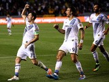 Robbie Keane #7 of the Los Angeles Galaxy celebrates with Alan Gordon #9 and Baggio Husidic #6 after scoring the Galaxy's second goal in the second half against the Chicago Fire at StubHub Center on March 6, 2015